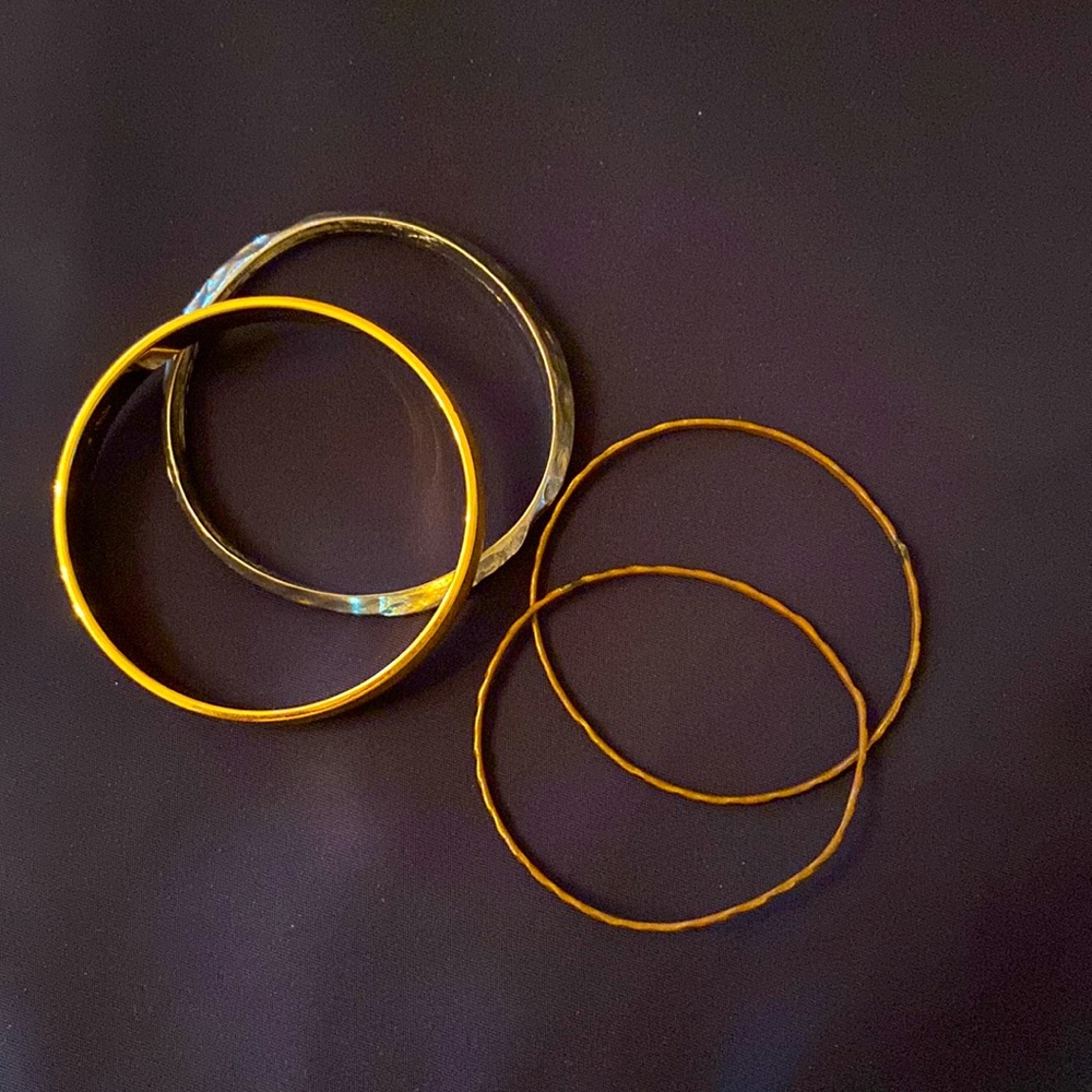 Stack of 4 bangle bracelets, gold, silver, copper